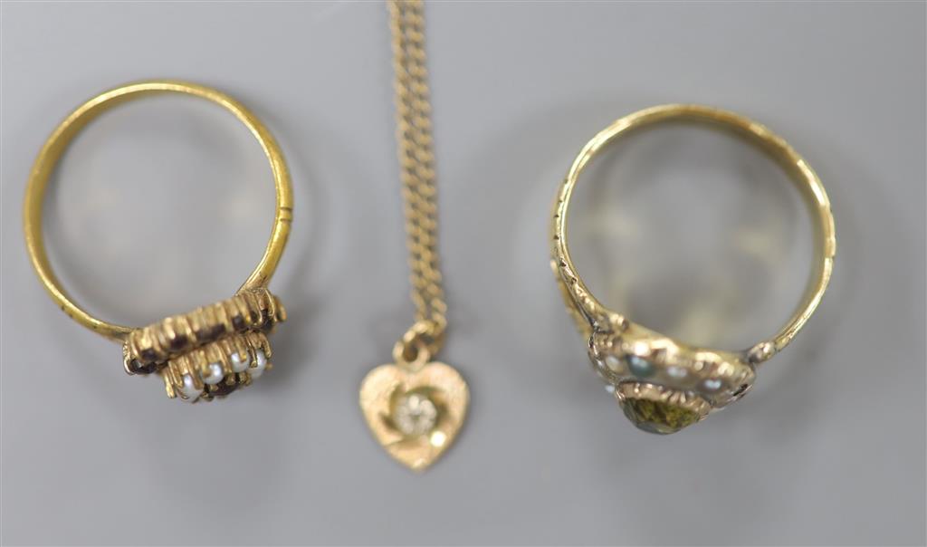 A 19th century yellow metal, foil backed gem and split pearl set dress ring, size O/P (a.f.), a ring and 9ct chain with heart pendant.